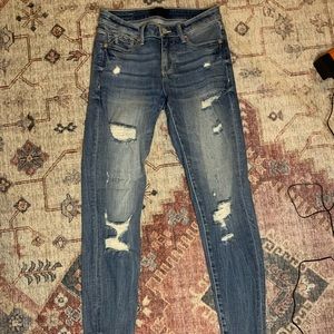 Buckle skinny jeans
